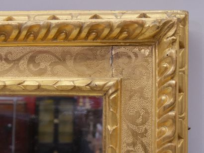 Wood and gilded stucco mirror with 2 patinas...