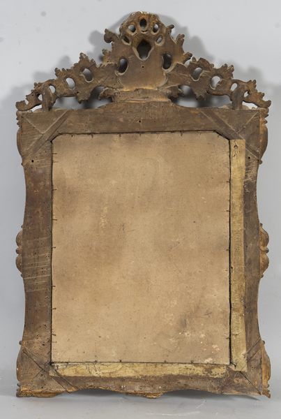 Gilded and carved wood mirror decorated with...