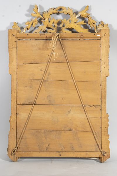 Mirror in a gilded wood frame with laurel...