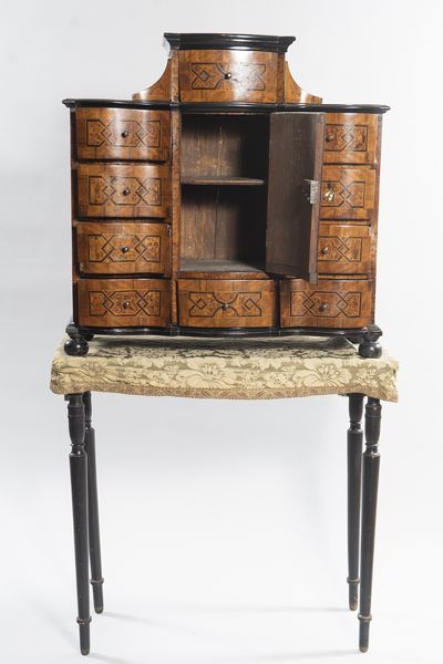 German cabinet in burr veneer, framed with...