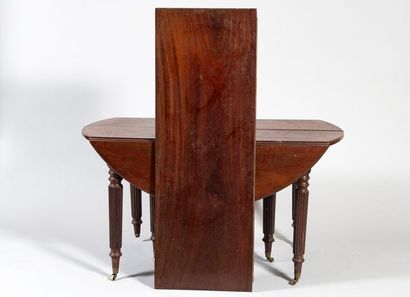 Mahogany dining table with shutters. It stands...