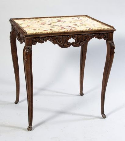 Molded and carved walnut table with openwork...