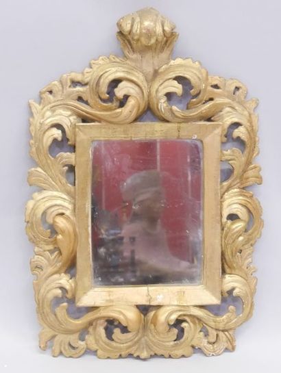 Mirror in a carved and gilded wood frame...