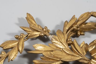 Mirror in a gilded wood frame with laurel...