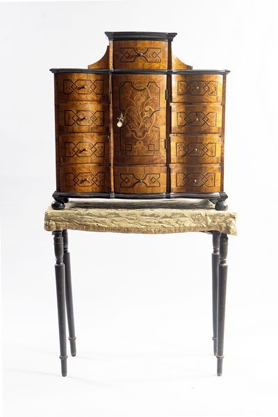 German cabinet in burr veneer, framed with...