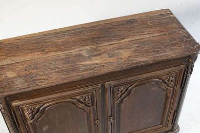 Oak paneled sideboard. It opens to 2 molded...