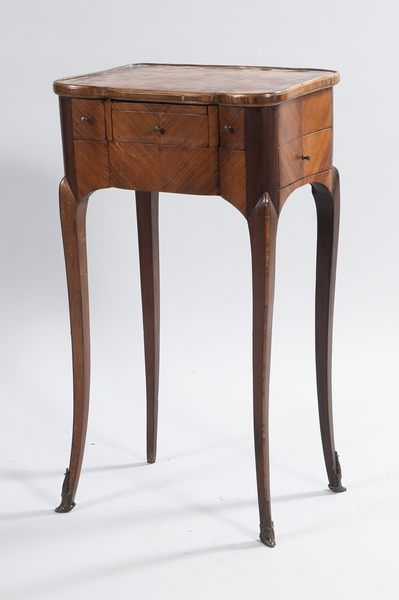 Veneered coffee table opening with 3 drawers...