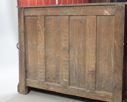 Oak paneled sideboard. It opens to 2 molded...
