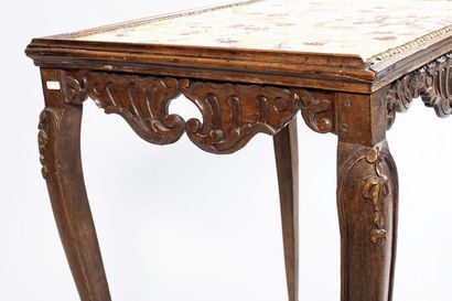 Molded and carved walnut table with openwork...