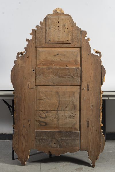 Miroir dans un encadrement à parcloses en...