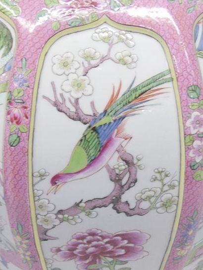 Pair of covered porcelain vases in the famille...