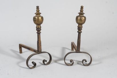 Pair of bronze andirons with turned decoration....