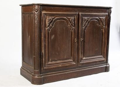 Oak paneled sideboard. It opens to 2 molded...