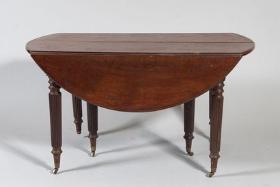 Mahogany dining table with shutters. It stands...