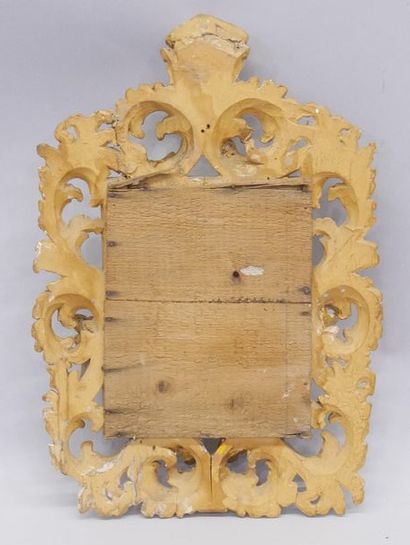 Mirror in a carved and gilded wood frame...