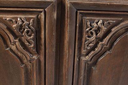 Oak paneled sideboard. It opens to 2 molded...