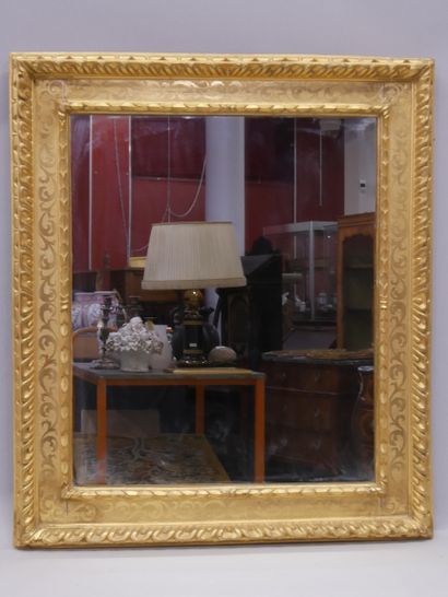 Wood and gilded stucco mirror with 2 patinas...