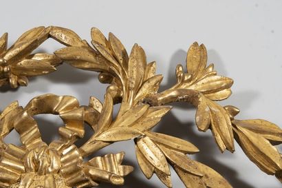Mirror in a gilded wood frame with laurel...