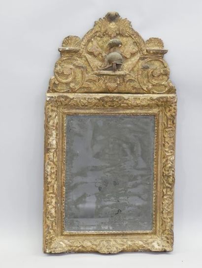 Mirror in a gilded and carved wood frame,...