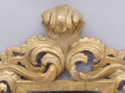 Mirror in a carved and gilded wood frame...