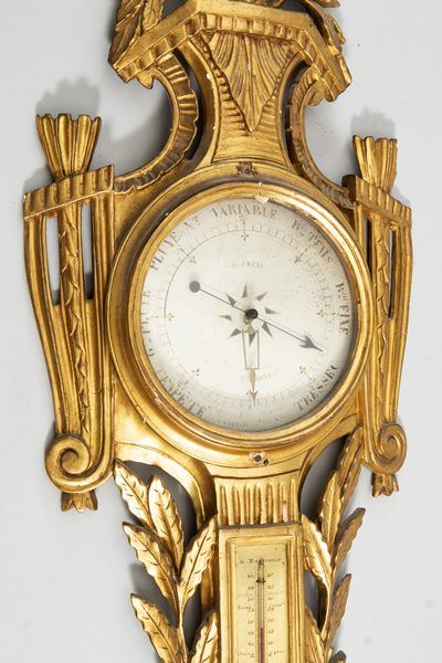 Baromètre, thermomètre en bois sculpté et...