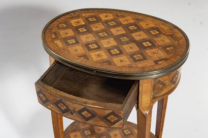 Oval lounge table in veneered wood and marquetry...