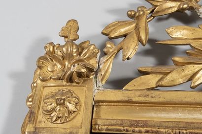 Mirror in a gilded wood frame with laurel...