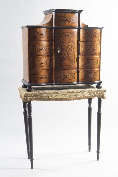 German cabinet in burr veneer, framed with...