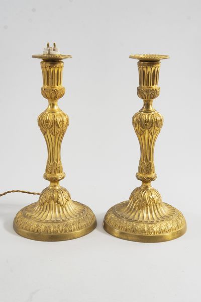 Pair of chased and gilt bronze candlesticks....