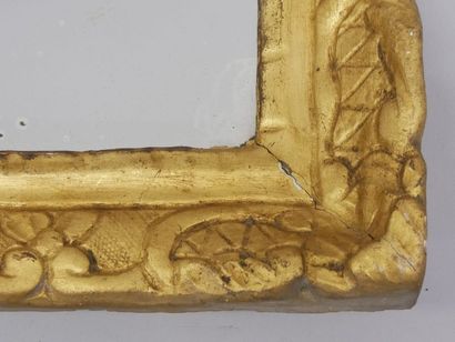 In a Regency-period carved and gilded wood...