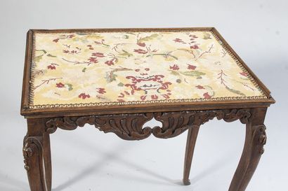 Molded and carved walnut table with openwork...