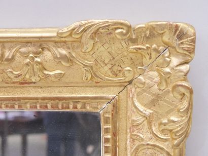 Mirror in a carved and gilded wood frame....