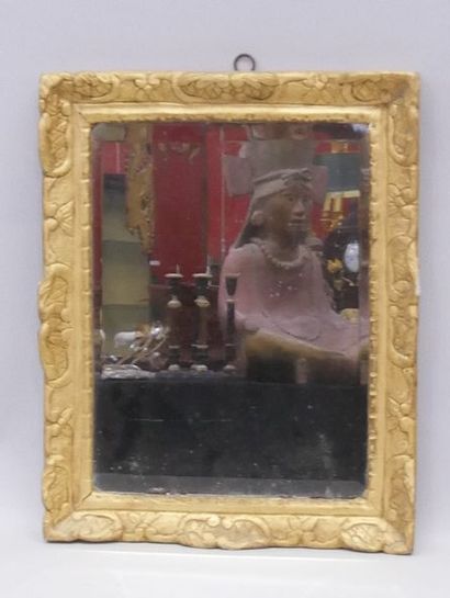 In a Regency-period carved and gilded wood...