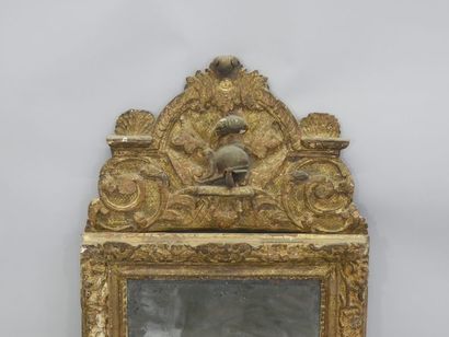 Mirror in a gilded and carved wood frame,...