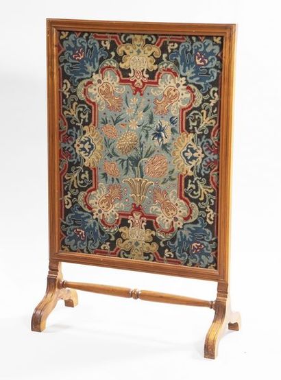 In a natural wood frame, a fireplace screen...