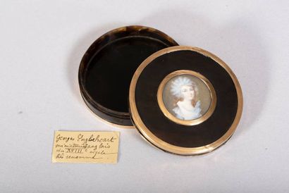 Circular brown tortoiseshell box with mobile...