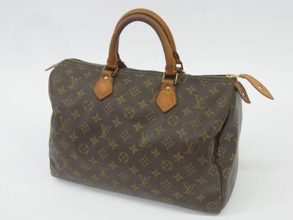 Louis VUITTON Sac modèle SPEEDY Numéro V...