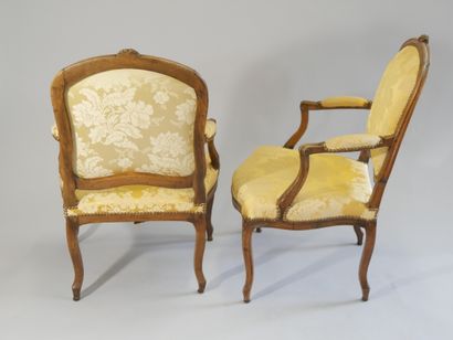 Pair of flat-back armchairs in carved and...