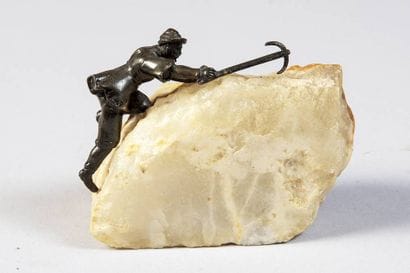 Bronze and stone statuette of a mountaineer...