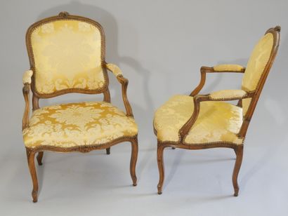 Pair of flat-back armchairs in carved and...