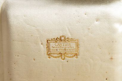 In an imitation morocco CARTIER case, silver...
