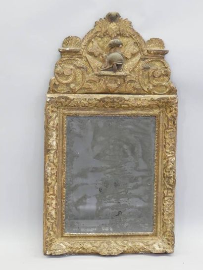 Mirror in a gilded and carved wood frame,...