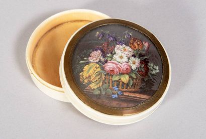 Circular ivory box with movable lid. On the...