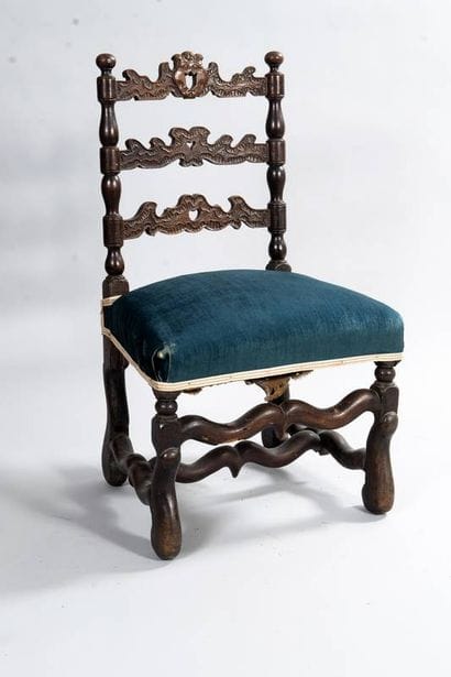 Walnut lounge chair with carved and curved...