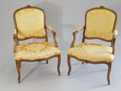 Pair of flat-back armchairs in carved and...