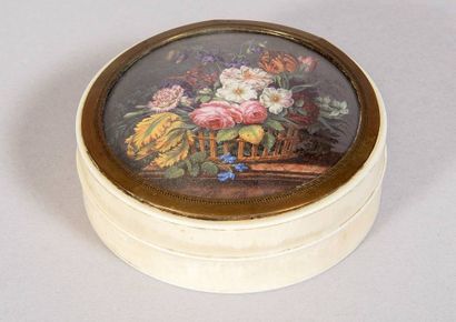 Circular ivory box with movable lid. On the...