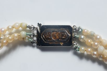 Three-row necklace of white cultured pearls,...