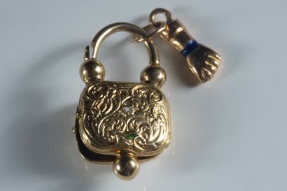 2 lock and hand pendants in yellow gold....