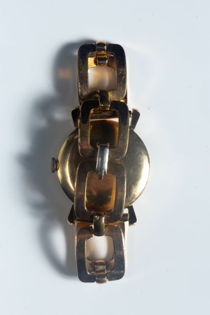 FLAMOR. Montre boîtier rond en or jaune (750...