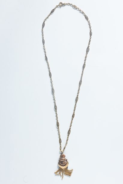 2 bijoux or jaune (750 millièmes):
- Un pendentif...